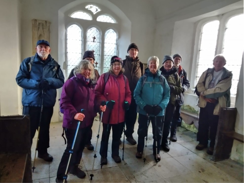 Walkers in a chapel.