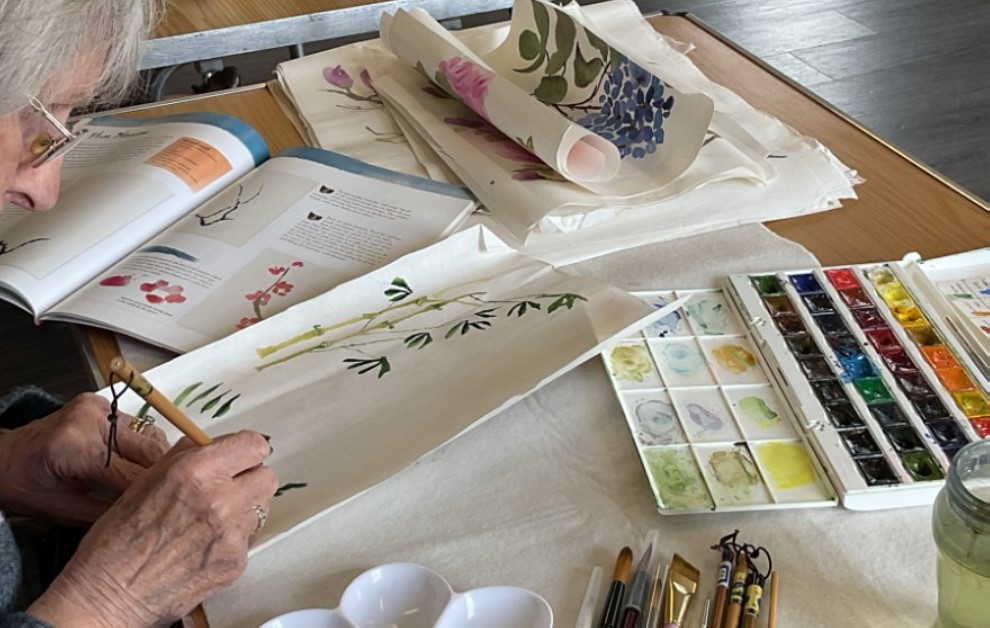 Painting group members at work