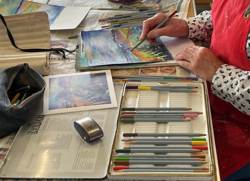 Painting group members at work