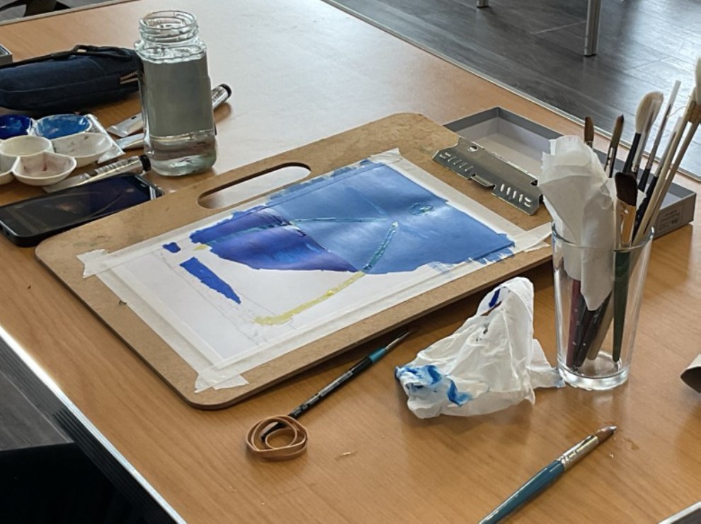 Painting group members at work