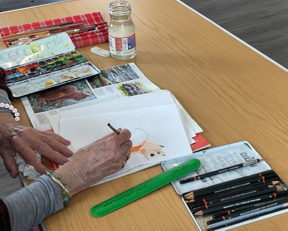 Painting group members at work