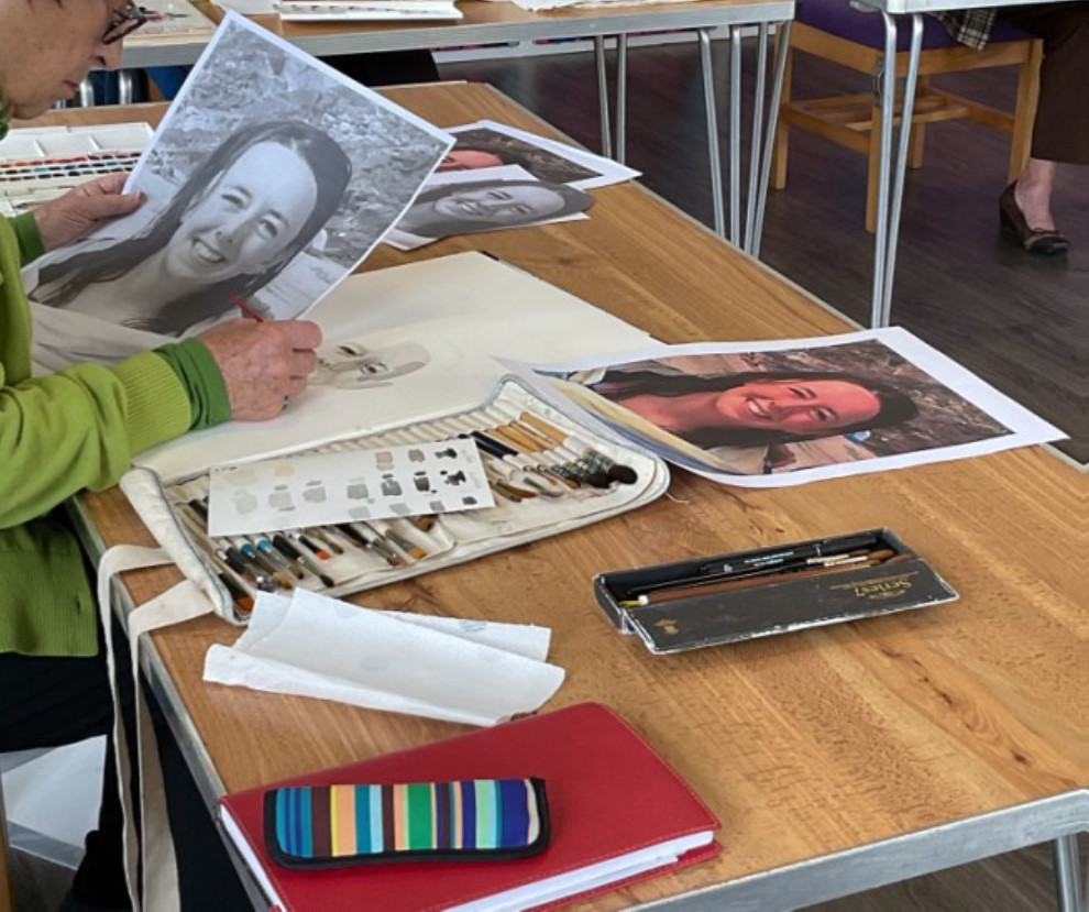 Painting group members at work